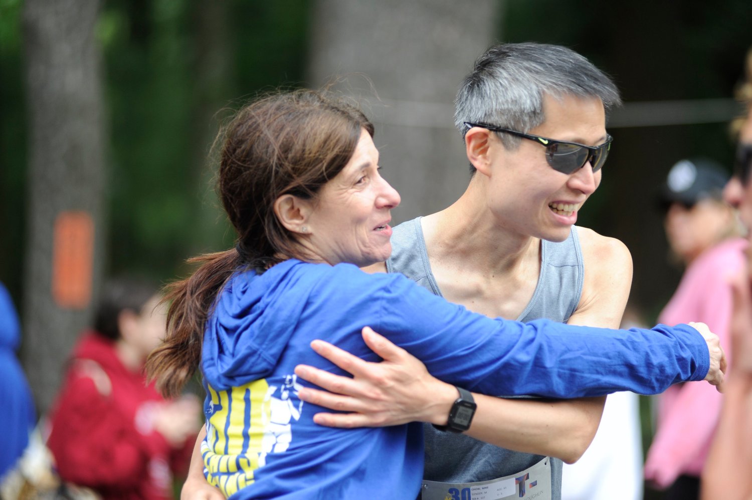 Leaders of the pack. Race director Suzy Rhulen Loughlin, left, is pictured with Mike Chow of Poughkeepsie, NY, moments before the start of the 5k race. Chow finished first overall, completing the course at 16:54.